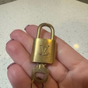 Louis Vuitton Gold Padlock with Key, authentic